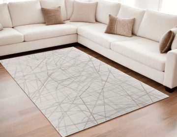 5' X 8' Gray and Ivory Abstract Hand Woven Area Rug